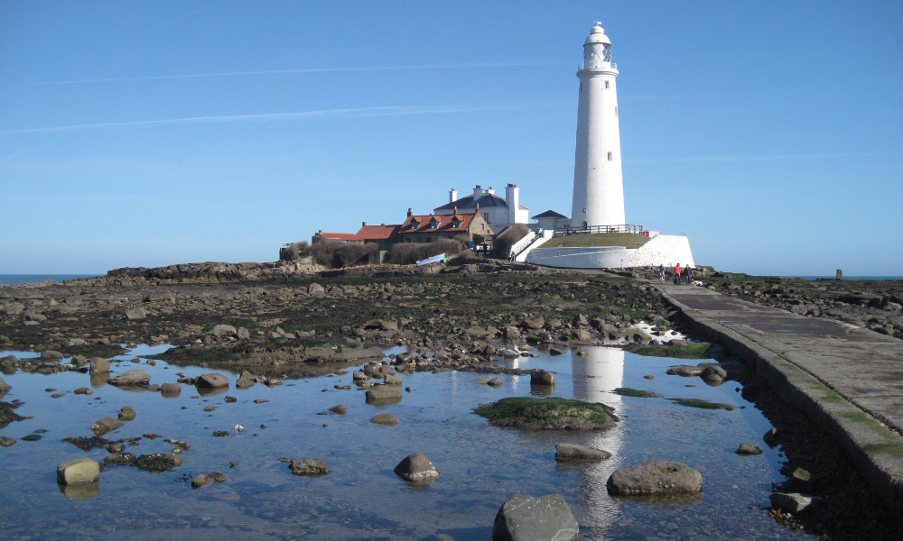 Lighthouse-Website-Slider-Image Lighthouse on a sunny beach in North Tyneside